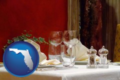 florida map icon and a French restaurant table setting